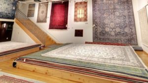 oriental rugs on floor and wall